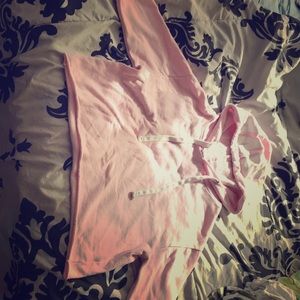 A pink crop top hoodie